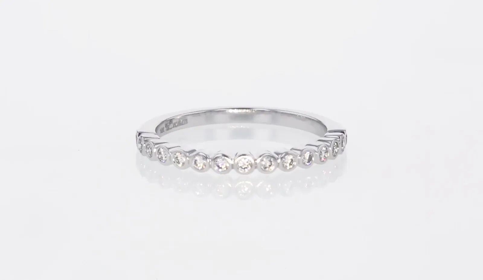 The Half Band Bezel Diamond Ring